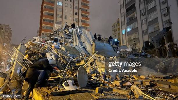 View of the destroyed building after earthquakes jolts Turkiye's provinces, on February 6, 2023 in Adana, Turkiye. Search and rescue works continue...