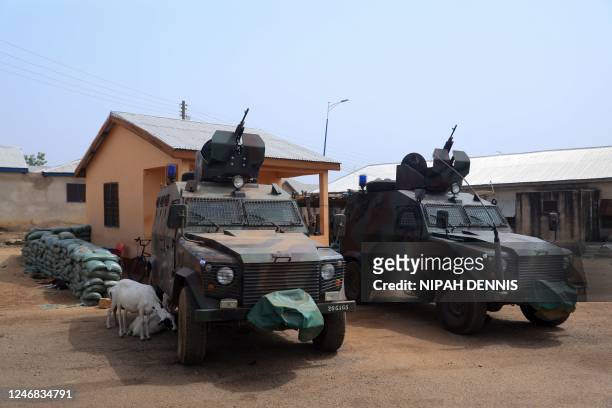 Armoured vehickles are positioned at a Military checkpoint at the Zug-raan palace in Bawku, northern Ghana, on December 7, 2022. - Ghana along with...