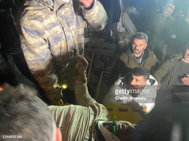 Citizen is rescued from the wreckage of a building during ongoing search and rescue efforts after earthquakes jolts Turkiye's provinces, on February...