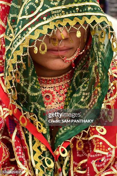 In this photograph taken on February 5 a Muslim bride attends a mass marriage ceremony organised by a welfare trust on the outskirts of Ahmedabad. -...