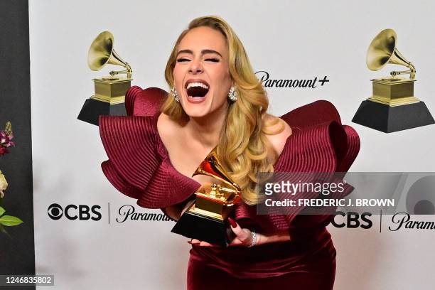 English singer-songwriter Adele poses with the award for Best Pop Solo Performance for "Easy on Me" in the press room during the 65th Annual Grammy...