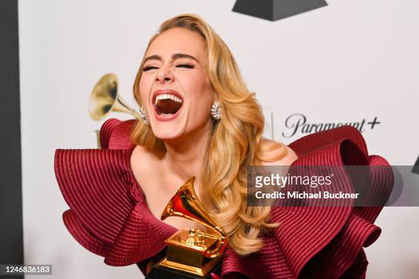 Adele poses with her GRAMMY award for Best Pop Solo Performance for Easy On Me in the Press Room at the 65th Annual GRAMMY Awards held at Crypto.com...