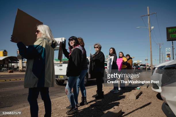 Protesters line the corner of Commerce and North Prince Street during a pro-choice rally held by Eastern New Mexico Rising in Clovis, NM on January...