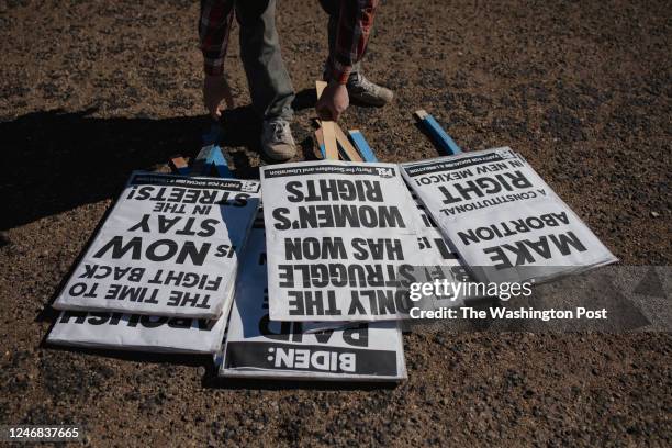 Protester picks up a sign at a pro-choice rally held by Eastern New Mexico Rising in Clovis, NM on January 22, 2022.