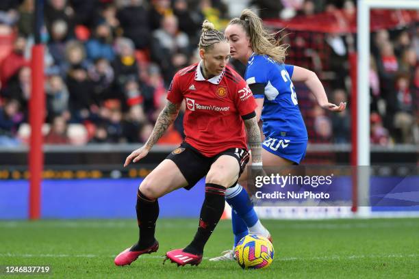 Leah Galton of Manchester United Women Football Club tussles with Megan Finnigan of Everton Womens Football Club during the Barclays FA Women's Super...