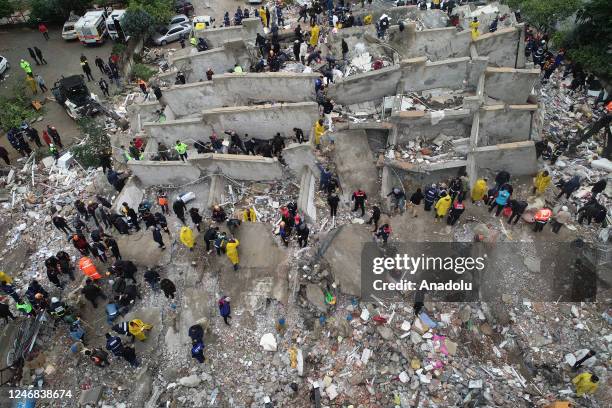 An aerial view shows search and rescue operation carried out at the debris of a building in Cukurova district of Adana after a 7.4 magnitude...