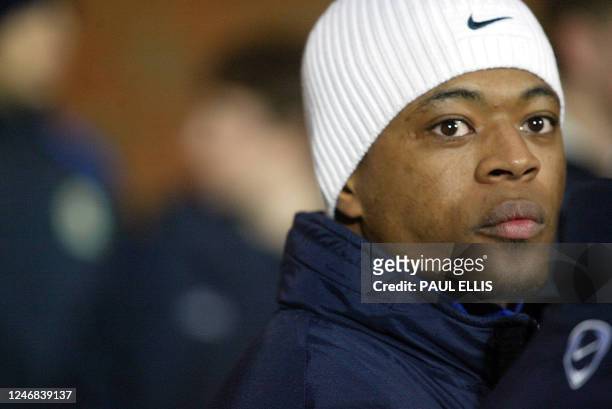 French international defender Patrice Evra watches his new teammates warm up following his move to Manchester United from Monaco, 11 January 2005....