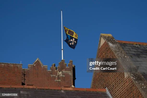 Flag flies at half mast at Epsom College after the school's head, Emma Pattison, was found dead alongside her family yesterday, on February 6, 2023...