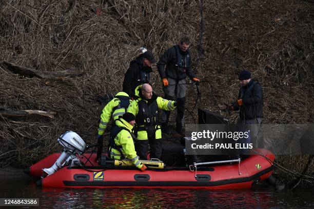 Specialist Group International CEO and founder Peter Faulding gestures as he stands aboard a RIB before using sonar to scan the bed of the River...