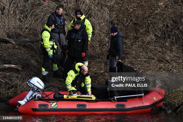 Specialist Group International CEO and founder Peter Faulding holds a sonar device aboard a RIB before scanning the bed of the River Wyre, near St...