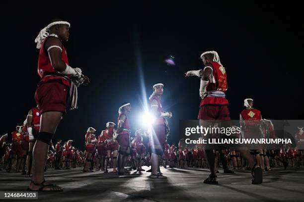 Muay Thai fighters gather around after performing the traditional Wai Kru ceremony during a festival for the Thai martial art in Rajabhakti Park in...