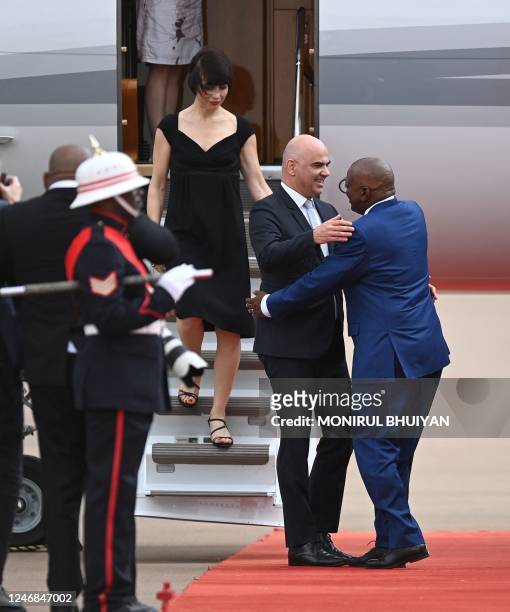 Swiss President Alain Berset is welcomed by Botswana President Dr Mokgweetsi Masisi as Berset's wife Muriel Zeender Berset disembarks on arrival at...