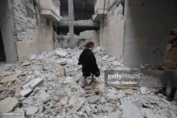 Child is seen among damaged buildings in Afrin district of Aleppo, Syria after 7.7 and 7.6 magnitude earthquakes hits Turkiye's Kahramanmaras, on...