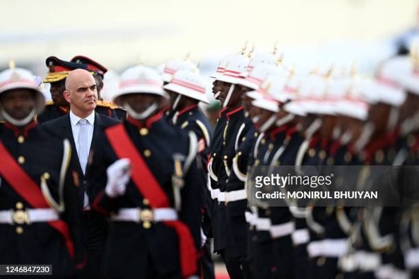Swiss President Alain Berset inspects a guard of honour mounted by the Botswana defence force soldiers on his arrival at the Sir Seretse Khama...