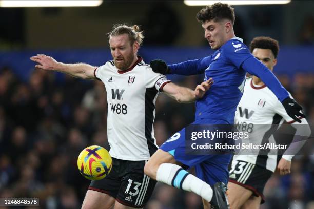 Tim Ream of Fulham and Kai Havertz of Chelsea challenge during the Premier League match between Chelsea and Fulham FC at Stamford Bridge on February...