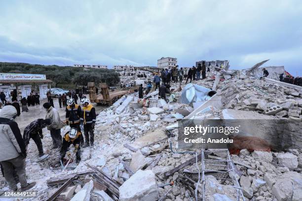 Personnel and civilians conduct search and rescue operations in Idlib, Syria after 7.7 and 7.6 magnitude earthquakes hits Turkiye's Kahramanmaras, on...