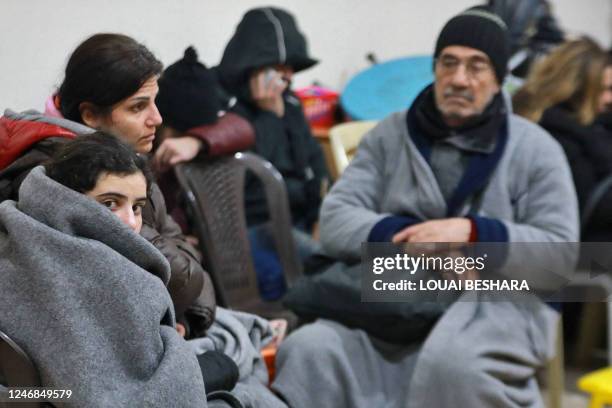 Syrians gather at a convent to spend the night as they fear more tremors following a deadly earthquaked on February 6 in Aleppo. - The Syrian...