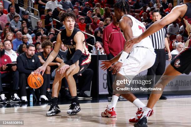 Florida State Seminoles guard Jalen Warley handles the ball during a college basketball game against the Louisville Cardinals on February 4, 2023 at...