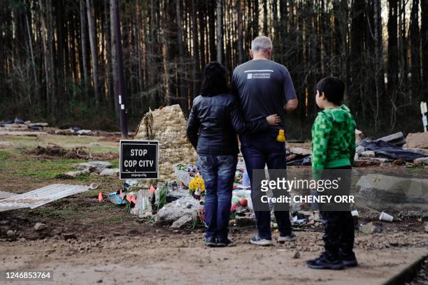 Family members of environmental activist Manuel Teran visit a makeshift memorial for Teran, was deadly assaulted by law enforcement during a raid to...