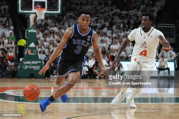 Duke Blue Devils guard Jeremy Roach dribbles the bal off of his foot as Miami Hurricanes guard Bensley Joseph defends during the game between the...