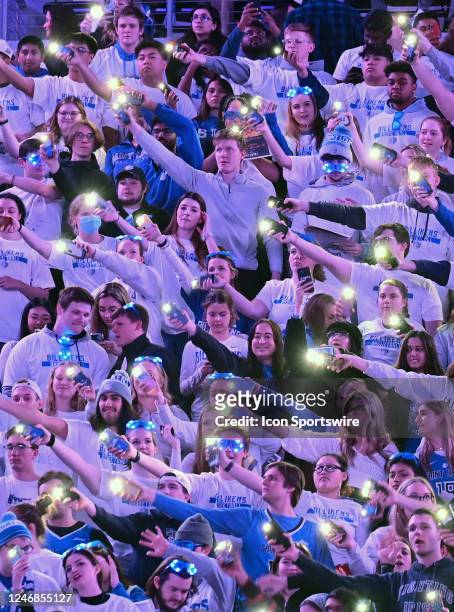 Saint Louis students illuminate the arena with their cellphone lights during a college basketball game between the VCU Rams and the Saint Louis...