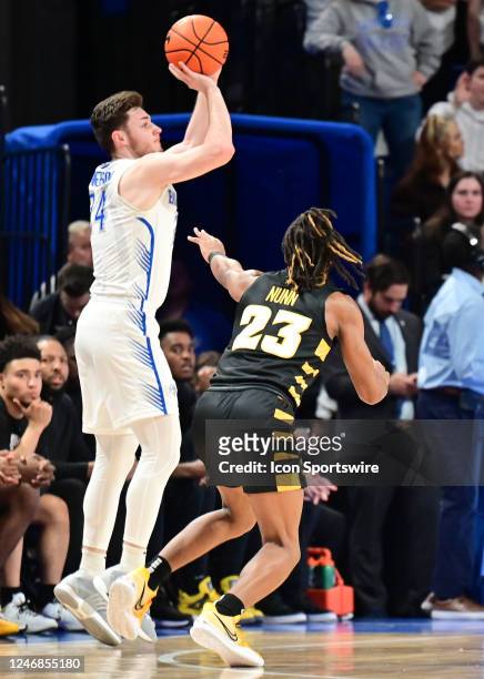 Saint Louis University guard Gibson Jimerson attempts a three-point shot during a college basketball game between the VCU Rams and the Saint Louis...