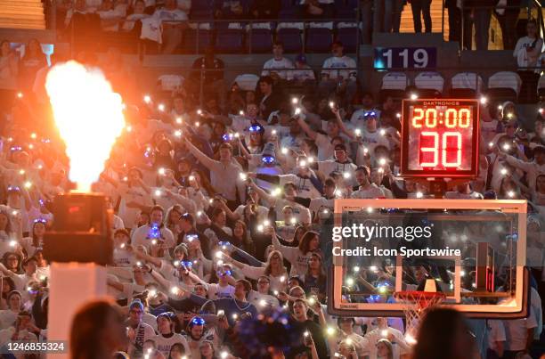 Saint Louis students illuminate the arena with their cellphone lights during a college basketball game between the VCU Rams and the Saint Louis...