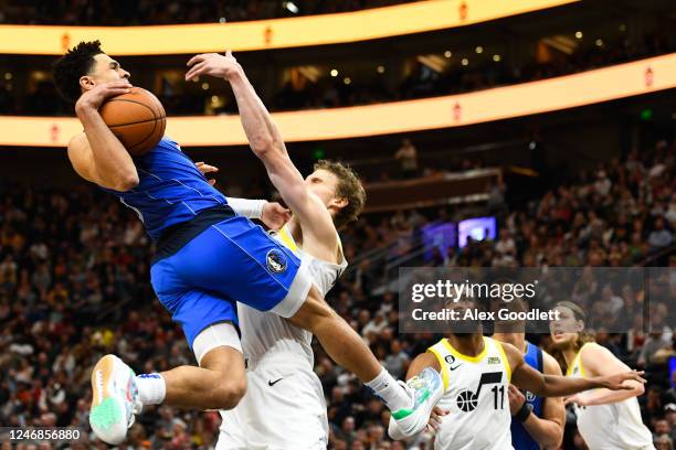 Josh Green of the Dallas Mavericks jumps into Lauri Markkanen of the Utah Jazz during the second half of a game at Vivint Arena on February 06, 2023...