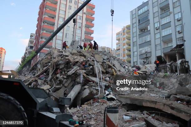 Search and rescue efforts continue around the wreckage of collapsed 14-storey-building in Adana, Turkiye following 7.7 and 7.6 magnitude earthquakes...