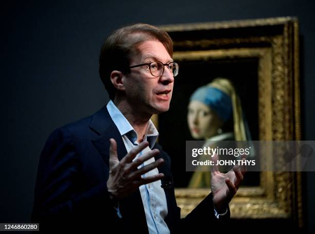 General Director of the Rijksmuseum Taco Dibbits speaks to journalists as he stands in front of a painting by the Dutch master Johannes Vermeer...