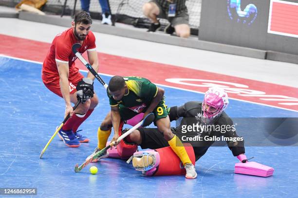 Lungani Gabela of South Africa, Mohan Gandhi and Jonathan Klages of USA during the FIH Indoor Hockey World Cup, Men's pool B match between USA and...