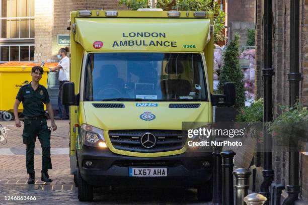Yellow ambulance, an emergency service vehicle with paramedics of the National Health Service NHS parked on the streets of the British capital....