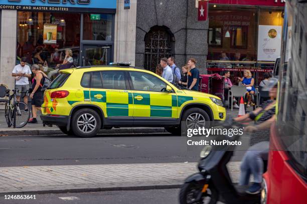 Yellow ambulance, an emergency service vehicle with paramedics of the National Health Service NHS parked on the streets of the British capital....