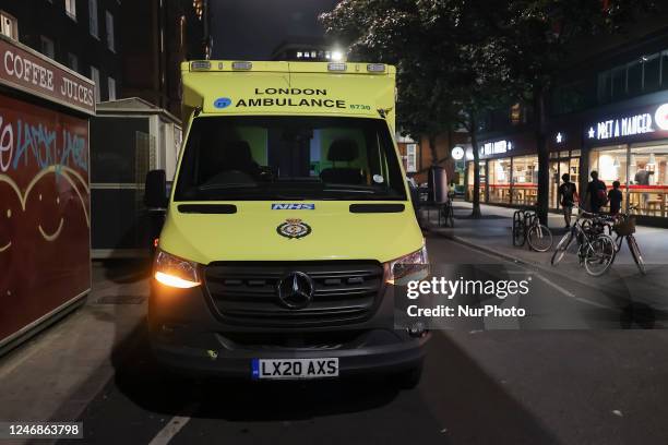 Yellow ambulance, an emergency service vehicle with paramedics of the National Health Service NHS parked on the streets of the British capital....