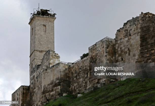 The minaret of the Ayyubid mosque inside Aleppo's ancient citadel is cracked following a deadly earthquake that shook Syria, on February 7, 2023. -...