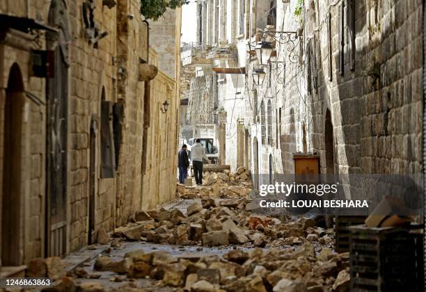 Picture shows rubble in Aleppo's old town on February 7, 2023 following a deadly earthquake. - The Syrian Red Crescent appealed to Western countries...