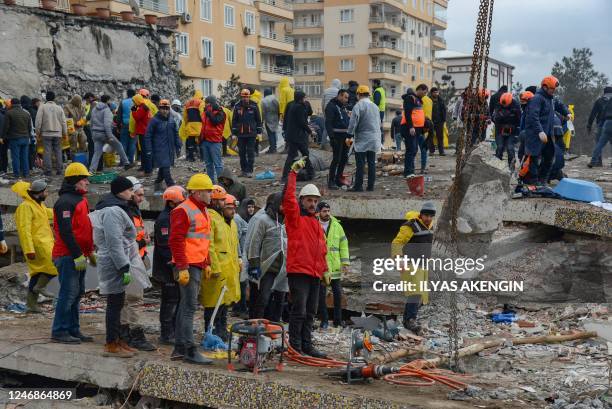 Rescuers search for victims and survivors in the rubble of buildings, a day after a 7.8-magnitude earthquake struck the country's southeast, in...