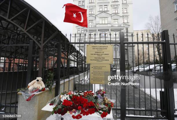 Flowers to tribute of the victims of the earthquake in Turkey and Syria are seen outside of the Turkish embassy in Kyiv, Ukraine 07 February 2023,...