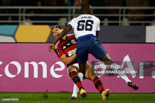 Flamengo's Brazilian defender Ayrton Lucas and Hilal's defender Saud Abdulhamid collide during the FIFA Club World Cup semi-final football match...