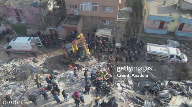 An aerial view shows a wounded woman is being rescued as search and rescue efforts continue after 7.7 and 7.6 magnitude earthquakes hit multiple...