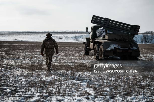 Ukrainian serviceman of the artillery unit of the 80th Air Assault Brigade walks near Bakhmut on February 7 amid the Russian invasion of Ukraine.