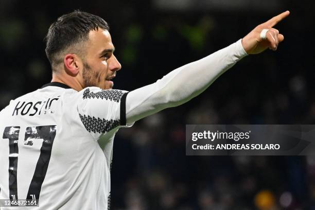 Juventus' Serbian midfielder Filip Kostic celebrates after scoring his side's second goal during the Italian Serie A football match between...