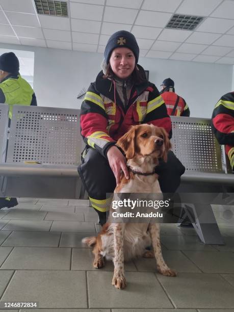 Rescue team member with a dog is seen as Ukrainian President Volodymyr Zelenskyy reports a search and rescue team from Ukraine is on the way to...