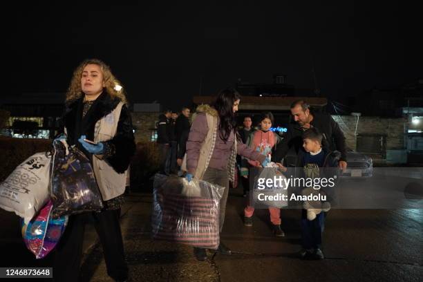 Iraqi people carry humanitarian aids to be sent for the victims of the devastating earthquakes in Turkiye as part of aid campaigns in Sulaymaniyah,...