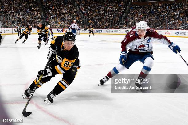 Brock McGinn of the Pittsburgh Penguins skates against Cale Makar of the Colorado Avalanche at PPG PAINTS Arena on February 7, 2023 in Pittsburgh,...