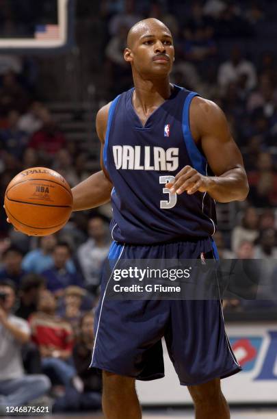 Travis Best of the Dallas Mavericks handles the ball against the Washington Wizards on November 2003 at the MCI Center in Washington DC. NOTE TO...