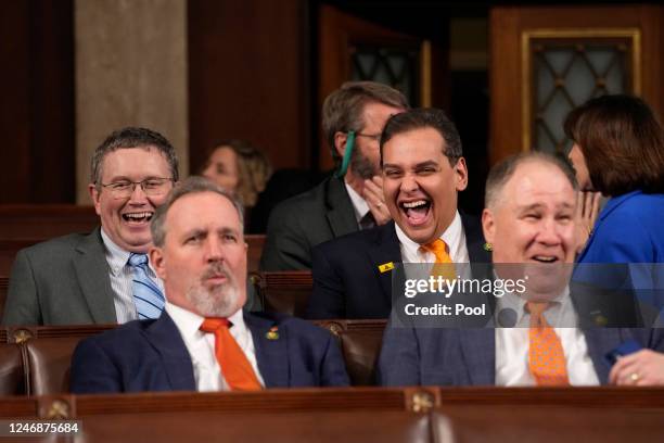 Rep. Thomas Massie and Rep. George Santos laugh before U.S. President Joe Biden delivers the State of the Union address to a joint session of...