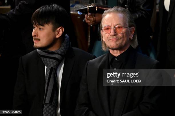 Irish singer-songwriter Bono and Brandon Tsay, the man who wrestled the gun away from a shooting suspect in Monterey Park, California, look out prior...