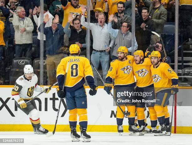 Matt Duchene celebrates his goal with Dante Fabbro and Roman Josi of the Nashville Predators against the Vegas Golden Knights during an NHL game at...