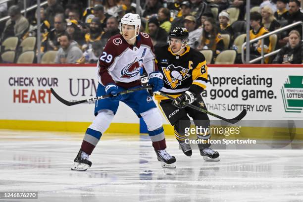Colorado Avalanche Center Nathan MacKinnon and Pittsburgh Penguins Center Sidney Crosby skate during the second period in the NHL game between the...